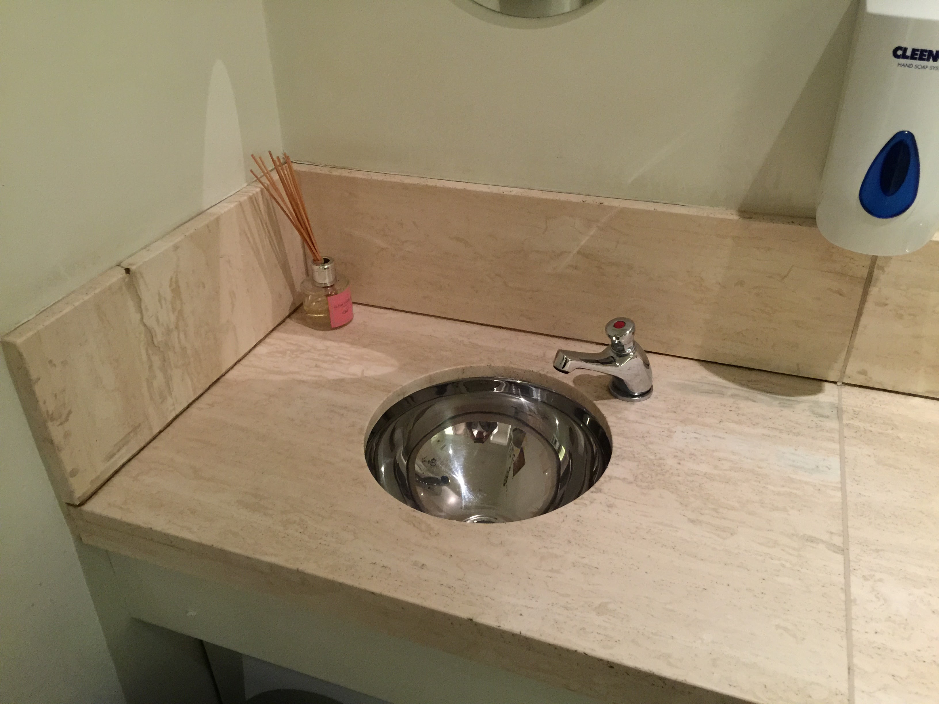 Clean commercial washroom after service