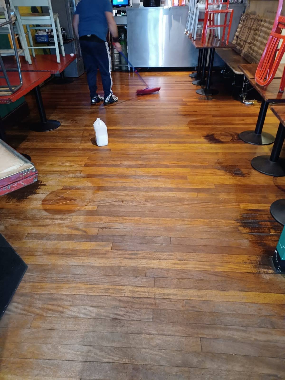 Professional cleaner vacuuming a modern office