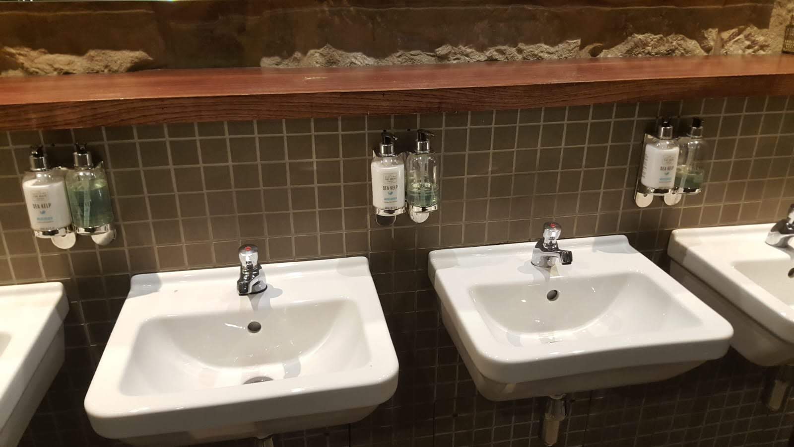 Commercial washroom basins, one of the areas covered by an office cleaning contract checklist